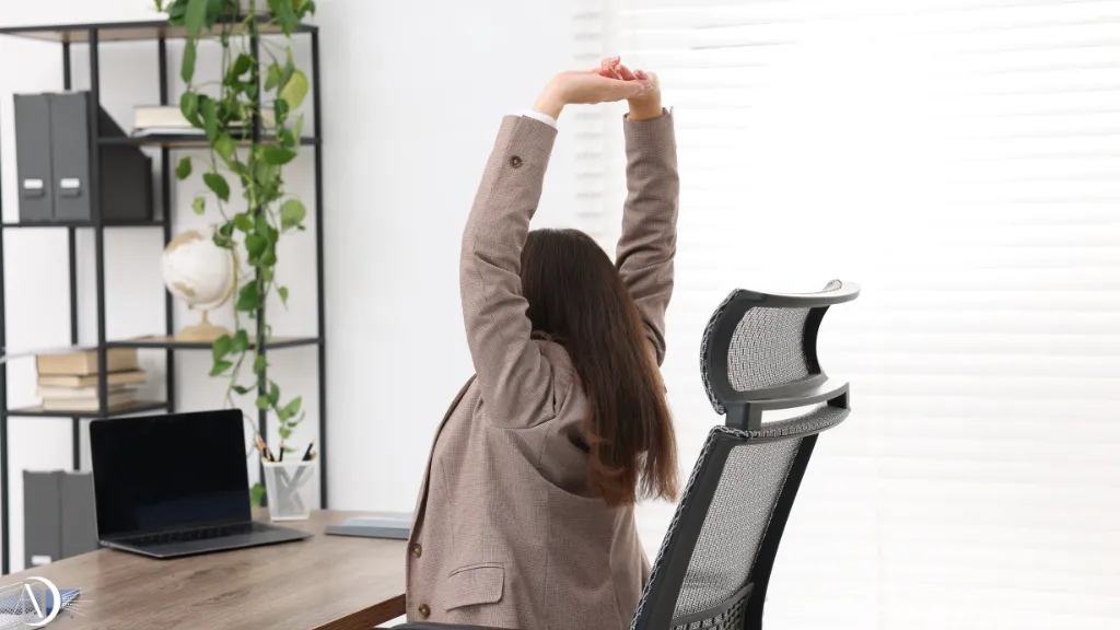 Person doing gentle stretches at office desk